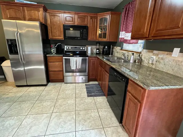 Bliss 2 kitchen with stainless appliances and granite counters