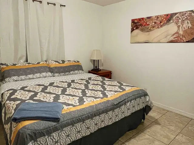 King bedroom with damask bedding