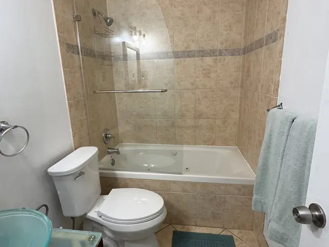 Bathroom with tub and shower