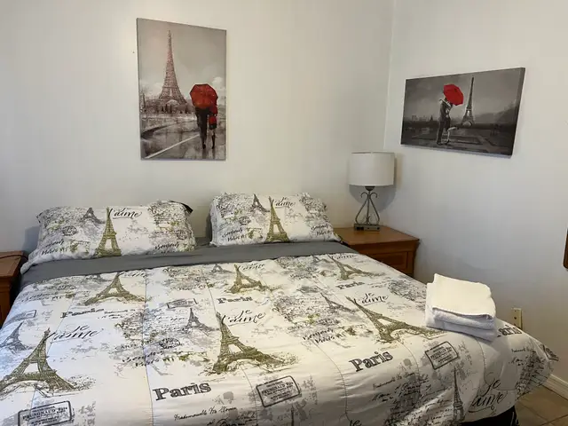 King bedroom with Eiffel Tower "je t'aime" bedding