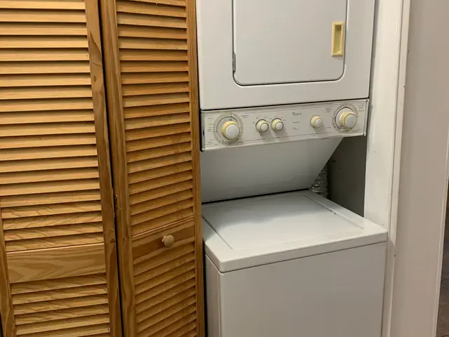 In-unit stacked washer and dryer